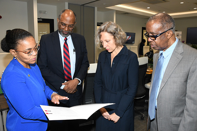 Programmes Director Aggie Krasnolucka signs the MOU.